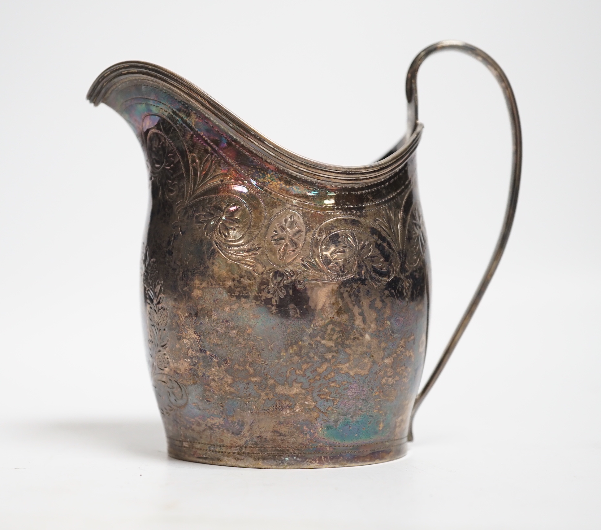 A George III engraved silver helmet shaped cream jug, London, 1799, 10.4cm, 3.2oz.
